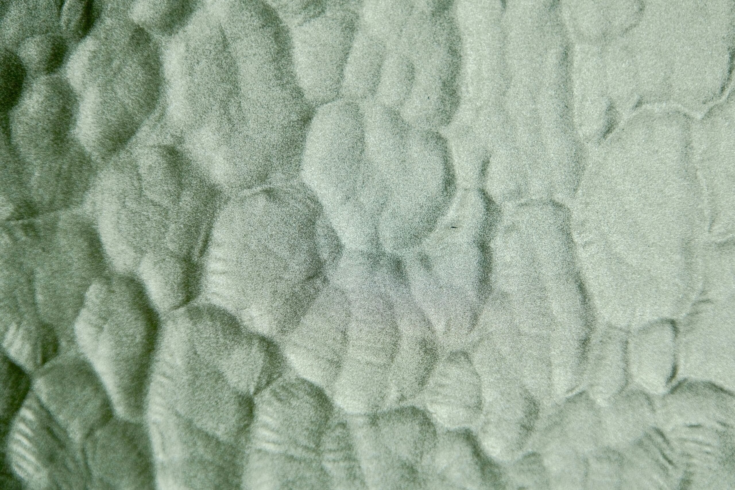 FineWoven material texture close-up - Abstract patterned texture with organic shapes