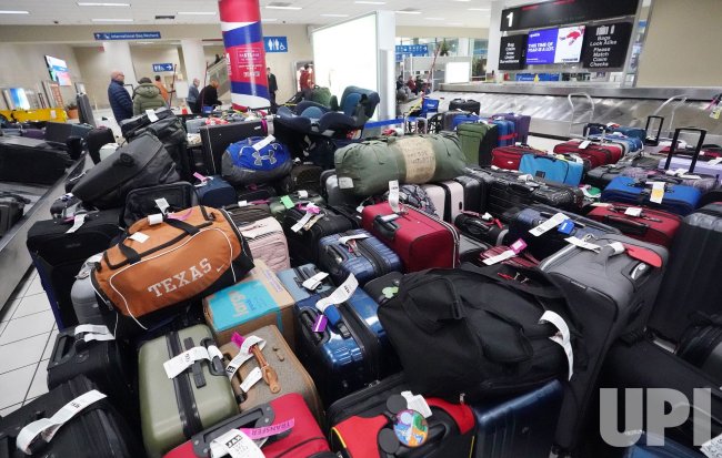 lost luggage at airport baggage claim - Photo: Hundreds Of Lost Luggage Pile Up At St. Louis Airport ...