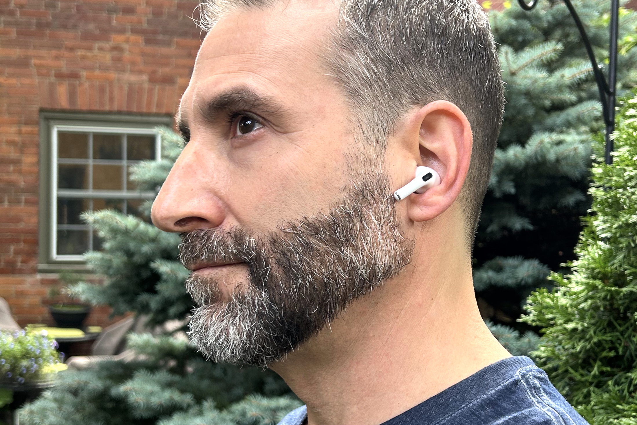 person using AirPods Pro 2 - Apple AirPods Pro 2 review: great buds get even better | Digital ...