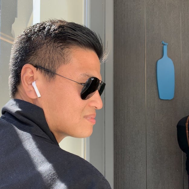 Person wearing AirPods - People Wearing AirPods Are Making Things Awkward For Everyone Else