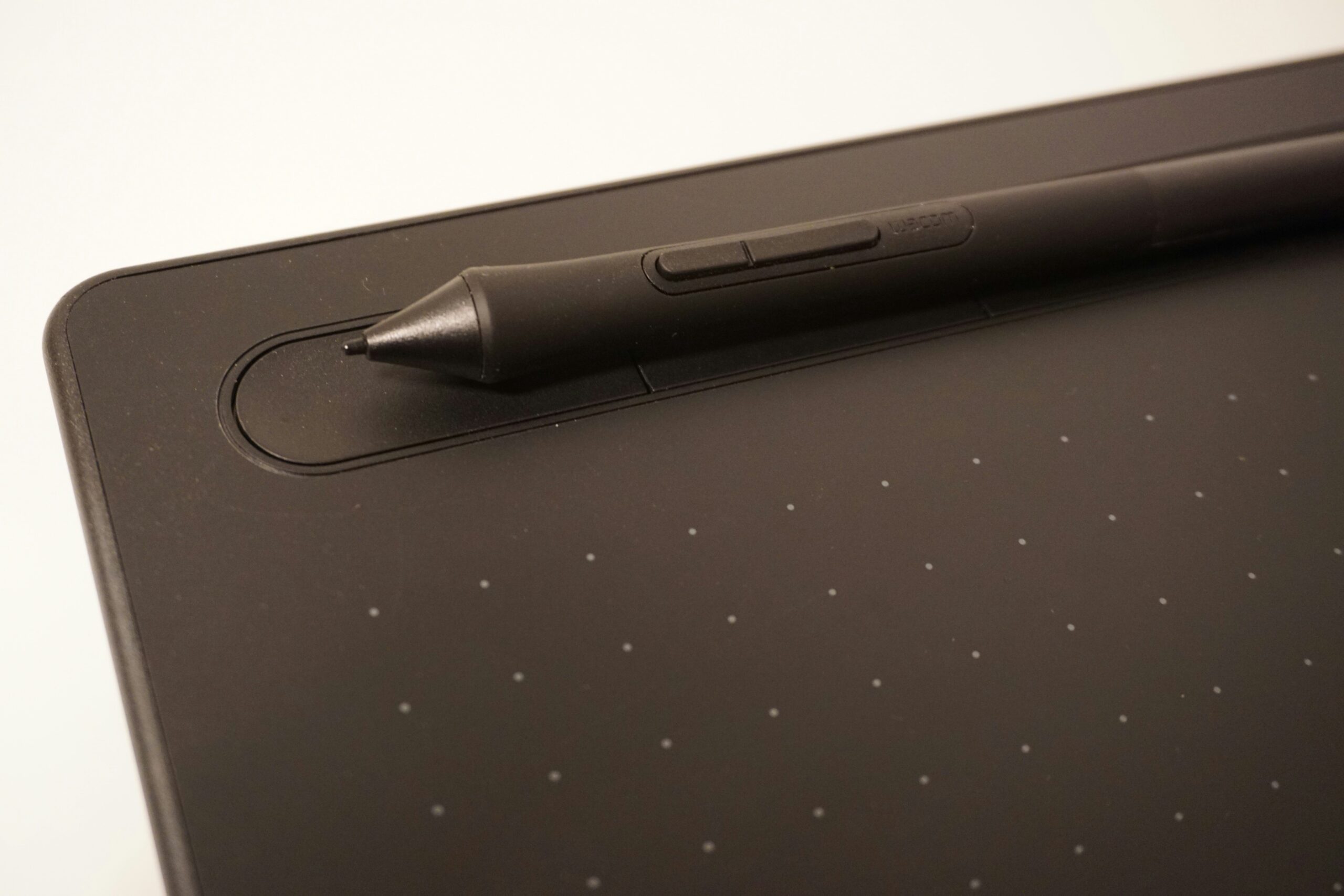 Futuristic stylus drawing on holographic interface - A closeup of a Wacom drawing tablet