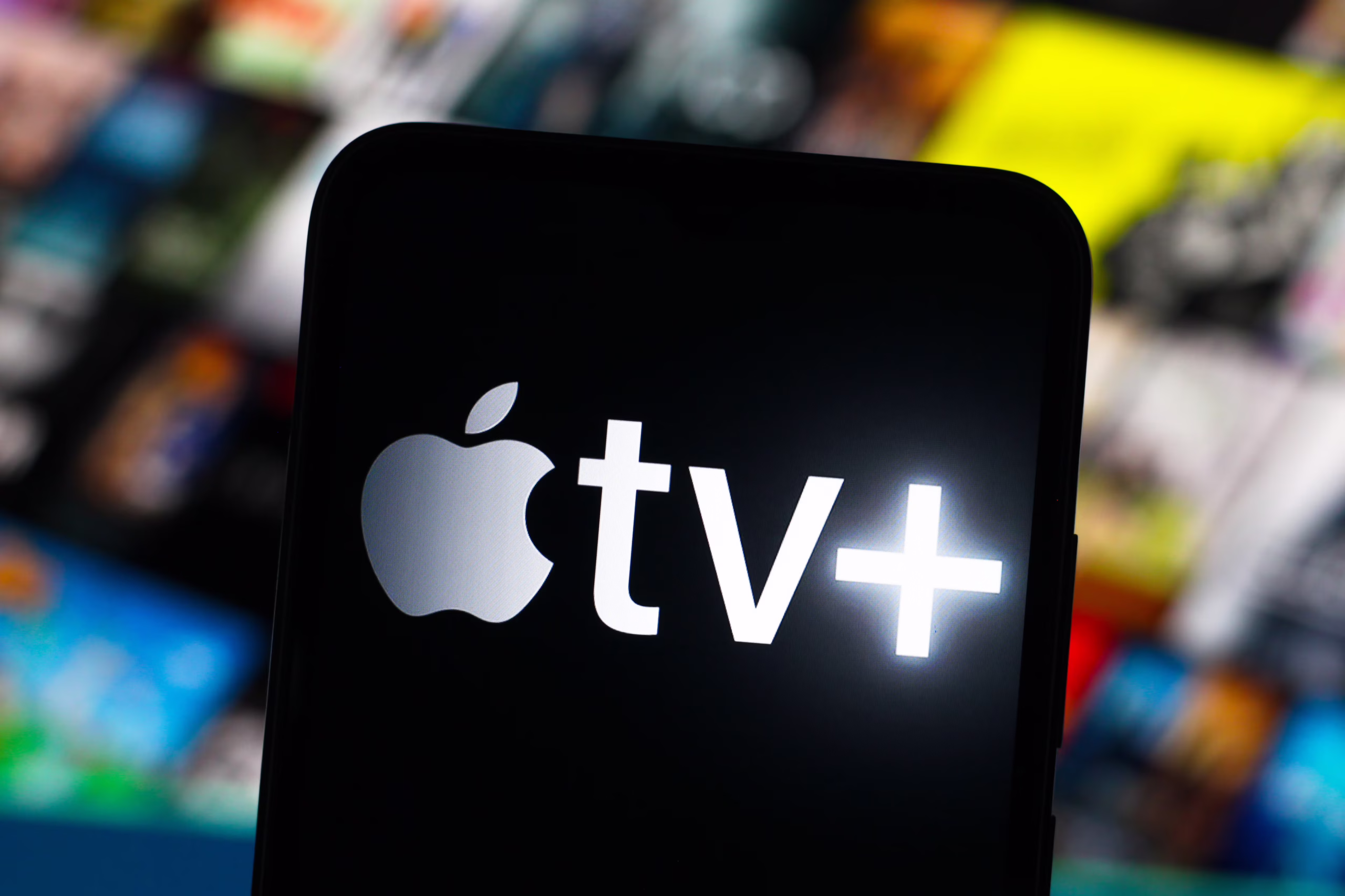 Apple TV+ logo on television screen - Find out what Apple TV+ is rebranding its name to for vibrant, new ...