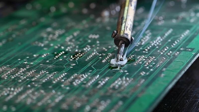 soldering iron circuit board close-up - Soldering circuit board on the table, close up. soldering iron and ...